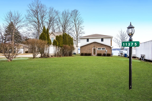 11375 SW Torch Lake Dr, Rapid City, MI 49676 - view of grassy yard