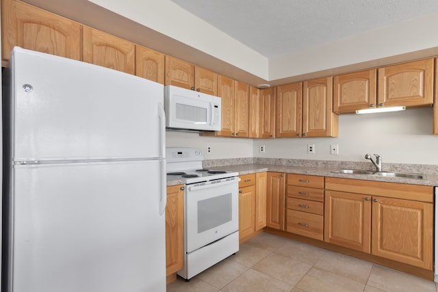 11375 SW Torch Lake Dr, Rapid City, MI 49676 - kitchen featuring white appliances, a sink, light tile patterned flooring, light countertops, and a textured ceiling