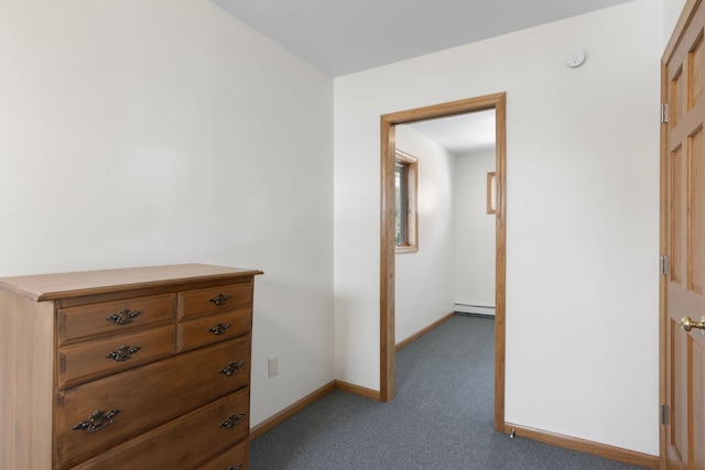 11375 SW Torch Lake Dr, Rapid City, MI 49676 - hallway with light colored carpet, baseboards, and baseboard heating