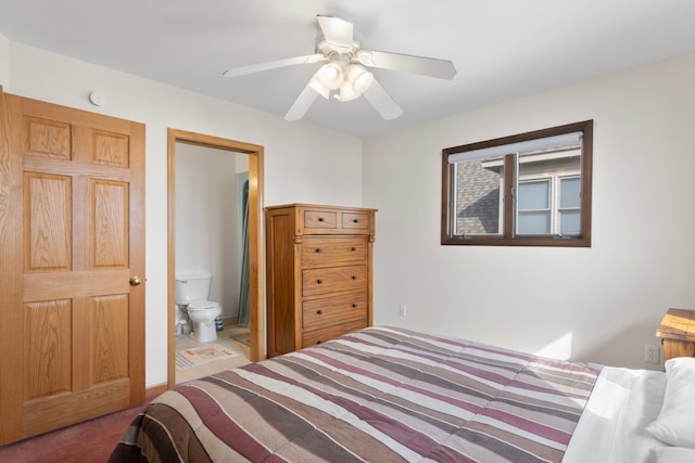 11375 SW Torch Lake Dr, Rapid City, MI 49676 - carpeted bedroom with a ceiling fan and ensuite bath