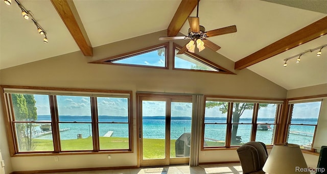 11375 SW Torch Lake Dr, Rapid City, MI 49676 - sunroom with rail lighting, a water view, and plenty of natural light