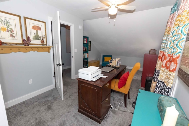 office with a ceiling fan, lofted ceiling, carpet, and baseboards