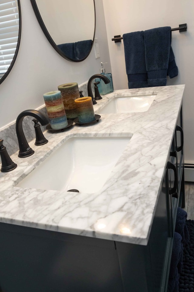 bathroom featuring double vanity and a sink