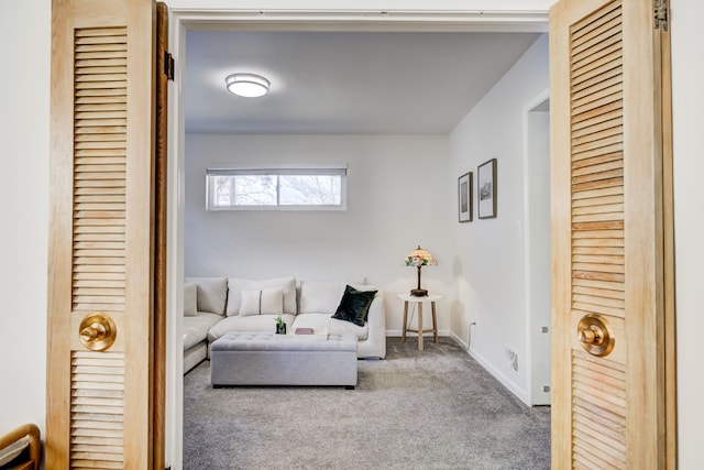 sitting room with carpet flooring and baseboards