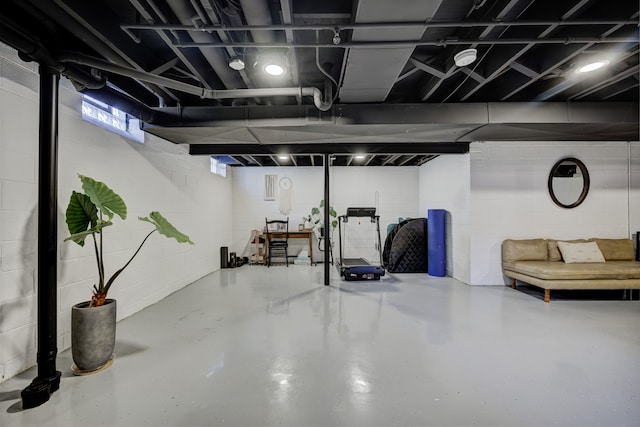 basement featuring concrete block wall