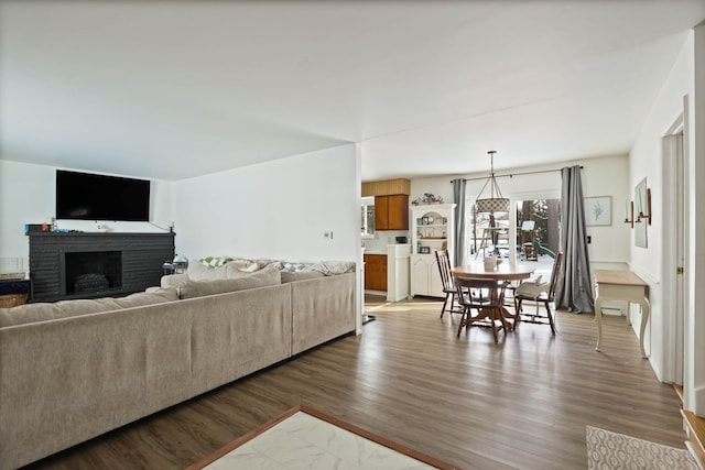 living area featuring a fireplace and wood finished floors