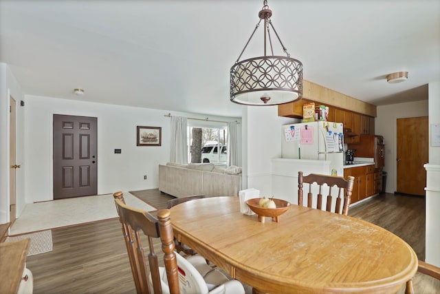 dining area featuring dark wood finished floors