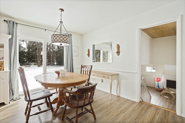 dining room featuring light wood-type flooring and a wealth of natural light