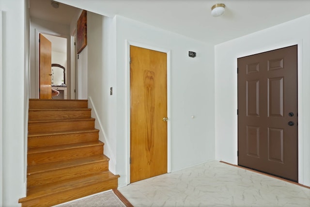 foyer entrance featuring stairway