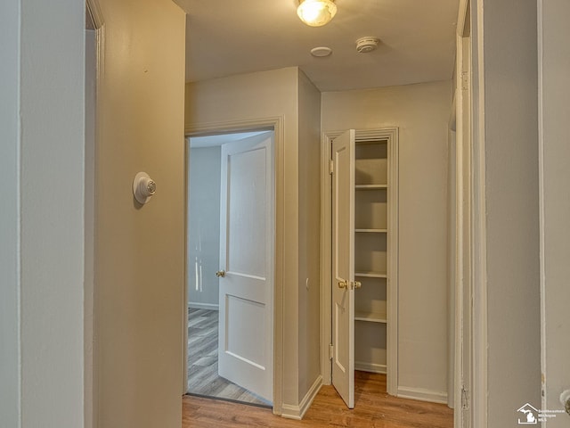 hallway featuring light wood-style flooring