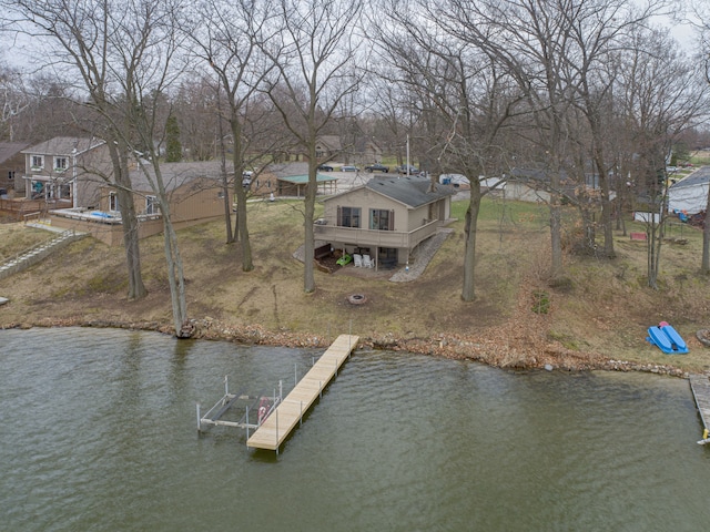 view of dock featuring a deck with water view