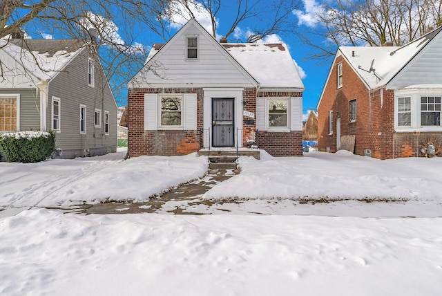 view of front facade featuring brick siding