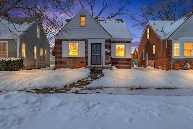 view of front of house featuring brick siding