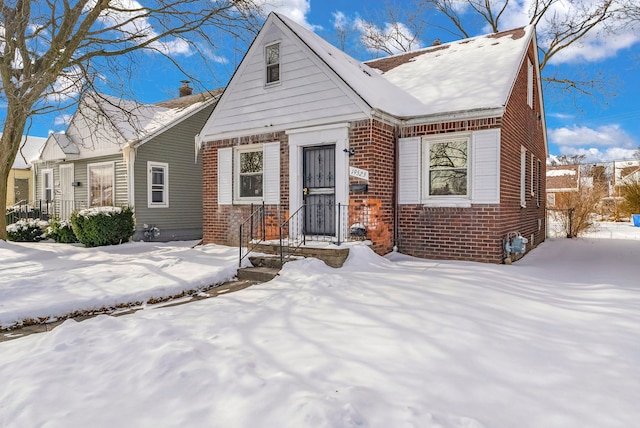 view of front of house featuring brick siding