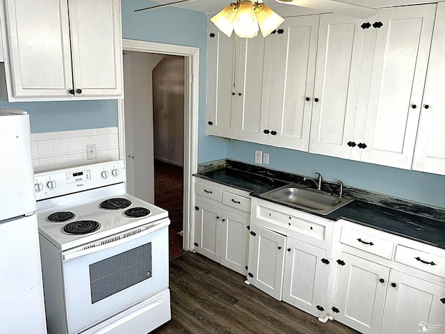 kitchen featuring white appliances, dark wood-style flooring, dark countertops, and white cabinets