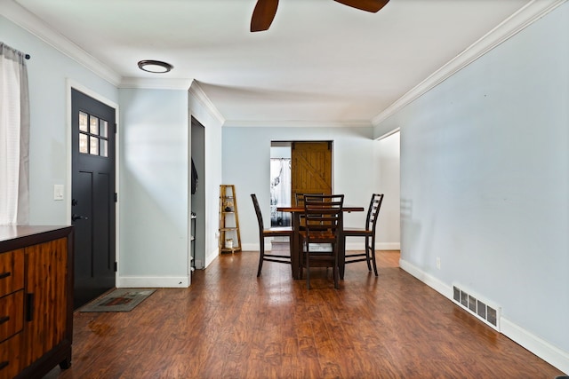 dining area with a ceiling fan, visible vents, baseboards, ornamental molding, and dark wood-style floors