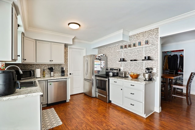 kitchen with dark wood-style floors, appliances with stainless steel finishes, ornamental molding, open shelves, and backsplash