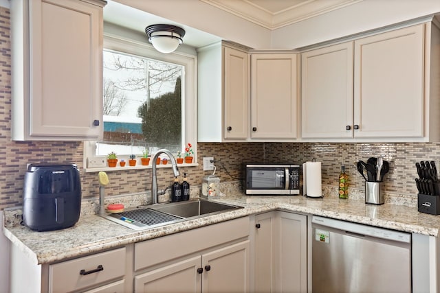 kitchen featuring ornamental molding, appliances with stainless steel finishes, a sink, and decorative backsplash