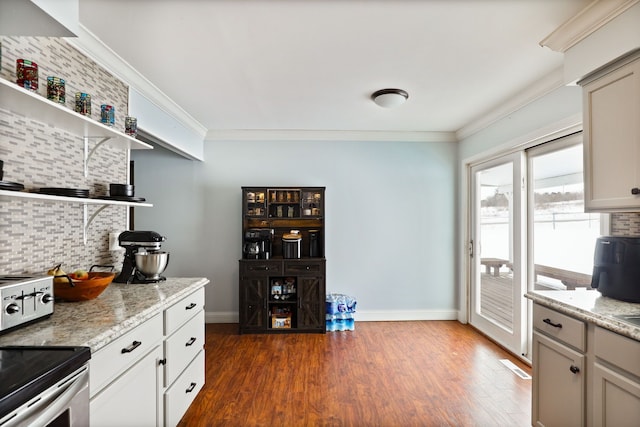 kitchen featuring crown molding, open shelves, backsplash, and light stone countertops