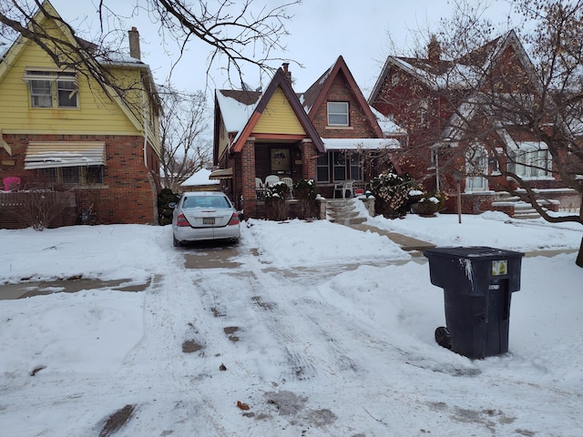 view of front of home featuring a garage and brick siding