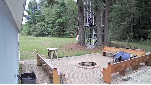 view of patio / terrace featuring an outdoor fire pit