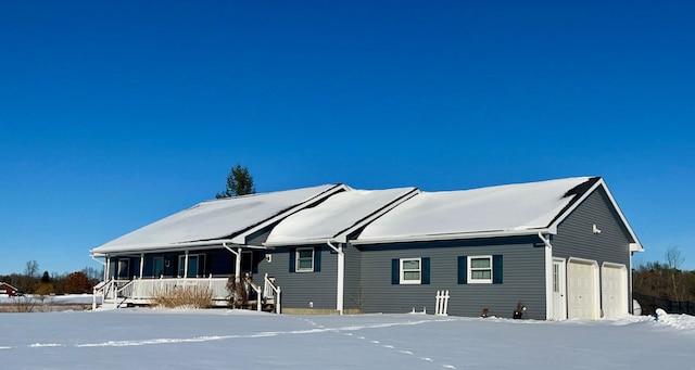 view of front of home with a garage and covered porch