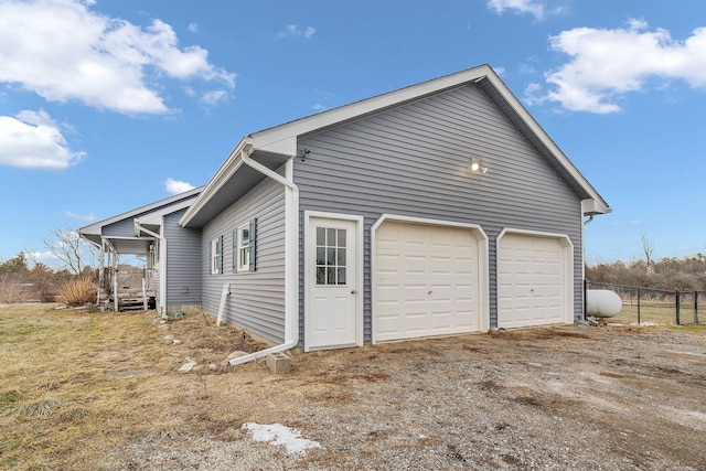 exterior space with fence and driveway