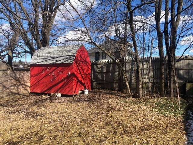 view of shed with fence private yard