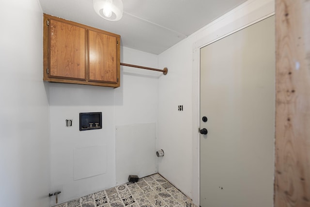 washroom with cabinet space and hookup for a washing machine