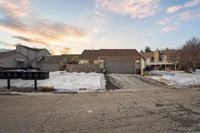 view of front of property with a garage, concrete driveway, and brick siding