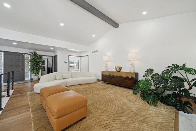 living room with recessed lighting, visible vents, lofted ceiling with beams, and wood finished floors