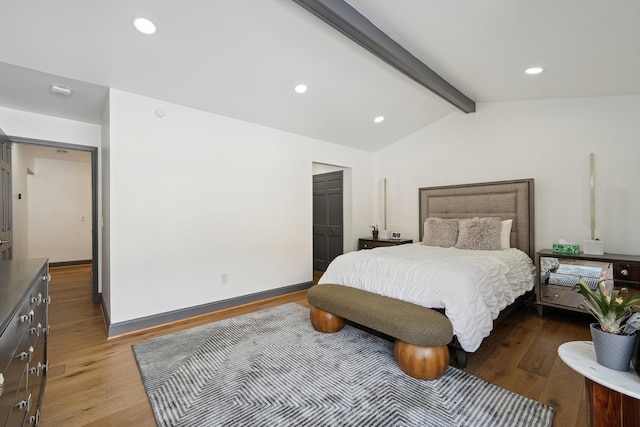 bedroom featuring recessed lighting, lofted ceiling with beams, baseboards, and wood finished floors