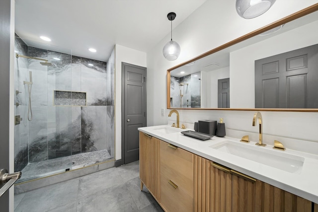 full bathroom featuring double vanity, recessed lighting, a sink, and a shower stall