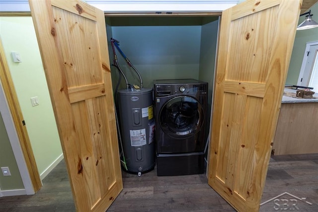 laundry room with washer / clothes dryer, electric water heater, dark wood-style flooring, and laundry area