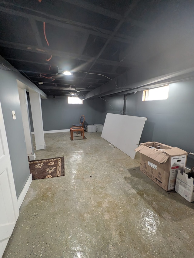 basement featuring a healthy amount of sunlight and baseboards