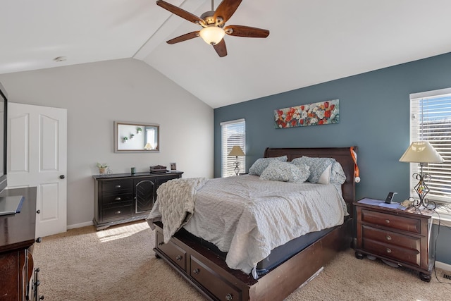 bedroom featuring baseboards, vaulted ceiling, a ceiling fan, and light colored carpet