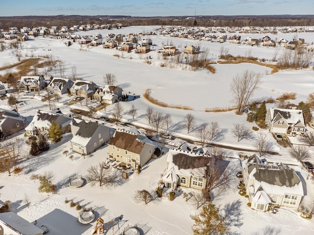 snowy aerial view featuring a residential view