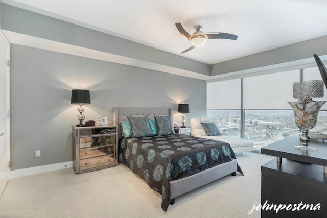 bedroom with a ceiling fan and baseboards