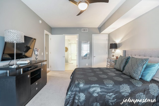 bedroom with carpet, visible vents, and a ceiling fan