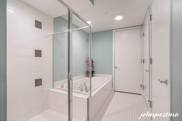 full bath with tile patterned flooring, a bath, and a shower stall