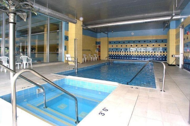 pool featuring a patio area