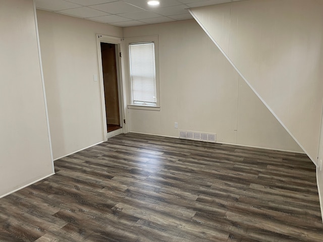 bonus room featuring dark wood finished floors and visible vents