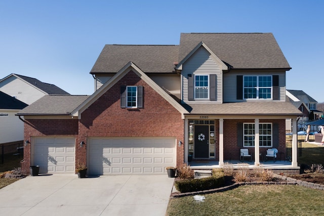 traditional-style house with a porch, brick siding, driveway, and roof with shingles