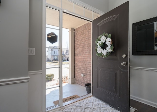 entryway with wood finished floors