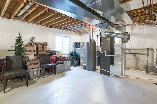 basement featuring gas water heater and heating unit