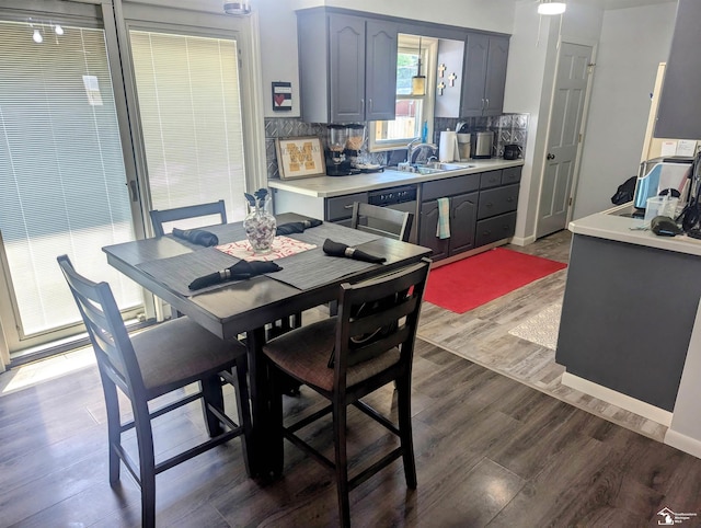 dining room featuring baseboards and wood finished floors