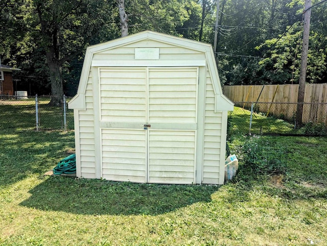 view of shed with fence