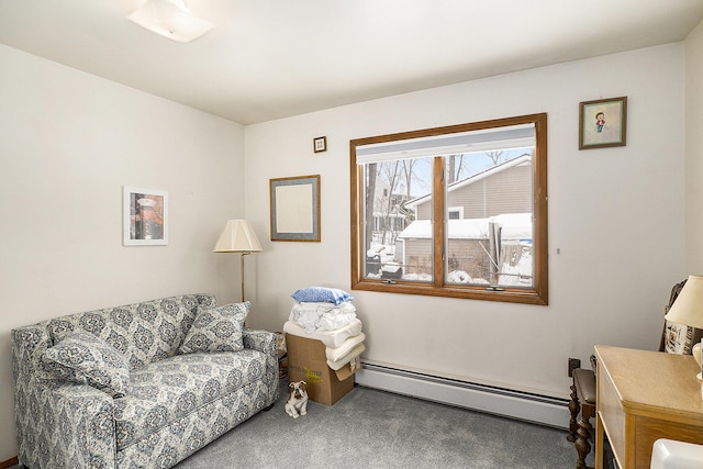 living area with carpet and baseboard heating