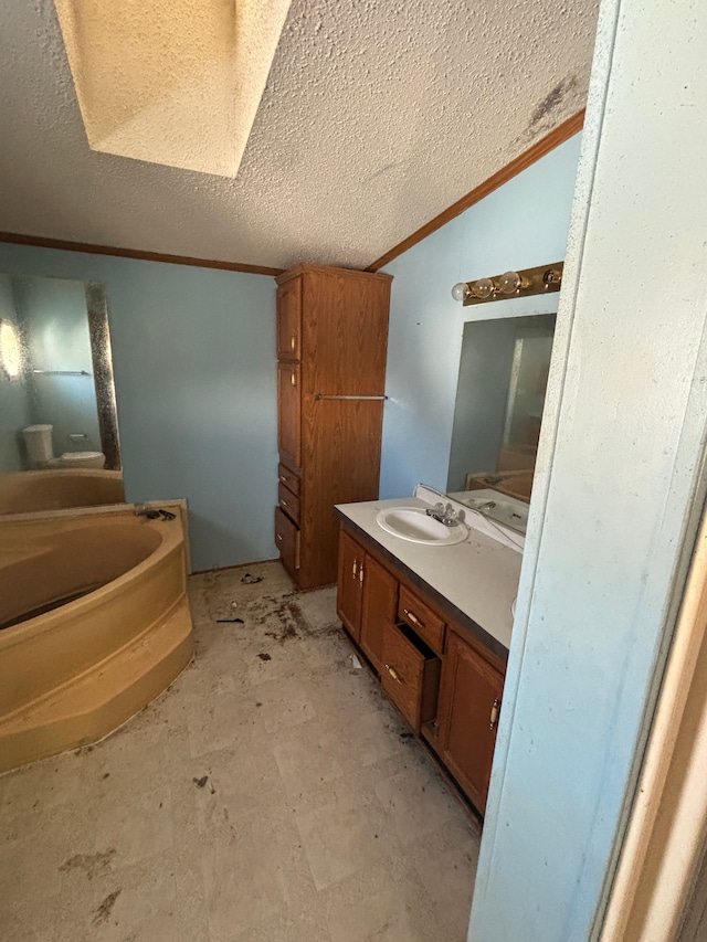 bathroom featuring crown molding, vaulted ceiling, vanity, a textured ceiling, and a bath