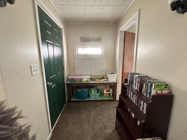 hallway with carpet and ornamental molding